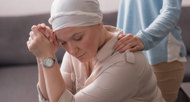 cropped shot of woman supporting sick mature mother in kerchief